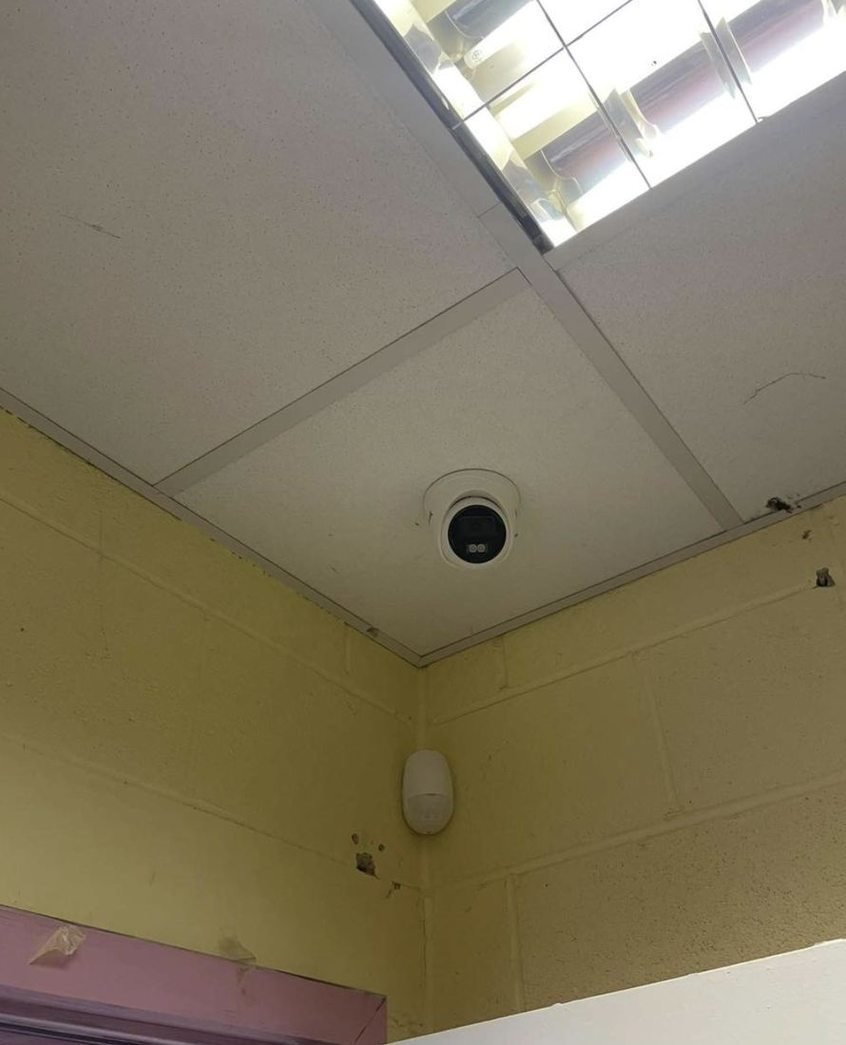 Dome CCTV camera in a ceiling grid