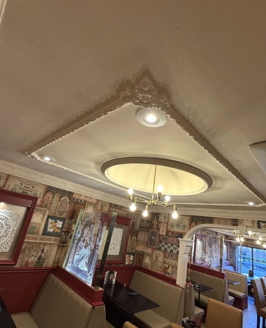 Dining room ceiling with downlights and a pendant